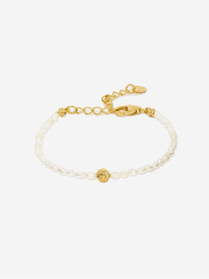 a genuine fresh water pearl bracelet featuring an organic gold vermeil bead at the centre. The bracelet is adjustable