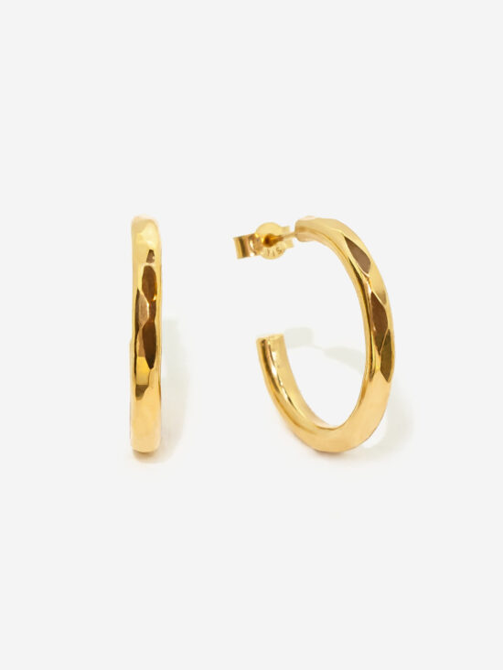 Gold Vermeil Hoop Earring in a medium and slightly chunky size. The hoops feature a faceted hammere texture and are 100% hand made