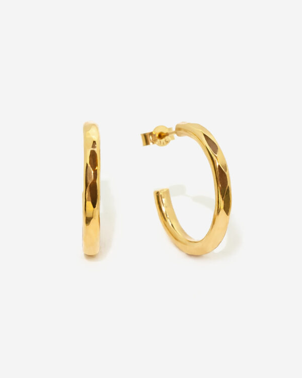 Gold Vermeil Hoop Earring in a medium and slightly chunky size. The hoops feature a faceted hammere texture and are 100% hand made