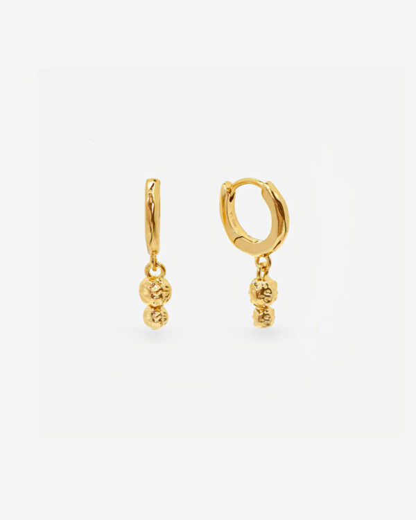 Gold drop earrings consisting of huggie hoops and organic beads dropping from them