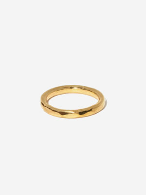 A thicker gold stacking ring with hammered facets. The ring is gold vermeil and 100% handmade