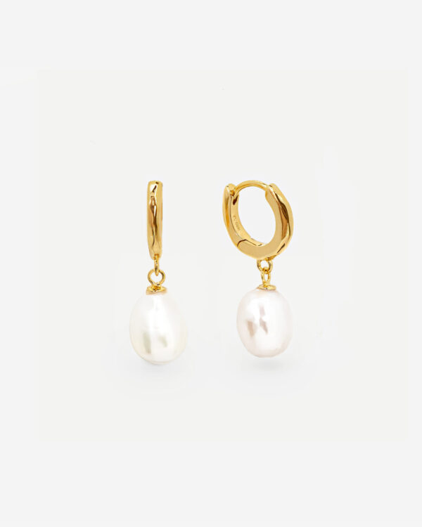 Pearl Hoop earrings that are made with lobe hugging hoops and a fresh water baroque pearl