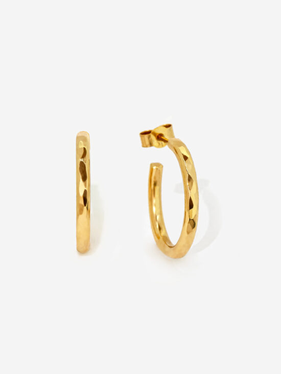 Small Gold Hoop earrings with a hammered texture that creates light reflecting facets. The ring is 100% handmade with Gold plated silver