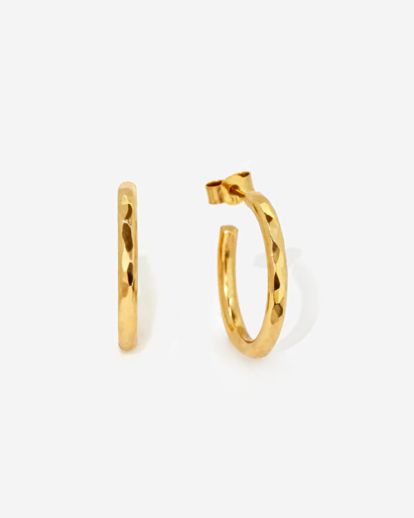 Small Gold Hoop earrings with a hammered texture that creates light reflecting facets. The ring is 100% handmade with Gold plated silver