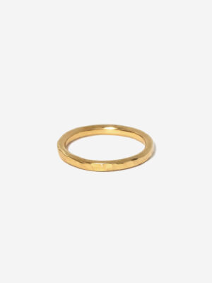A slim gold stacking ring with hammered texture for light reflecting qualities. the ring is gold vermeil and 100% handmade