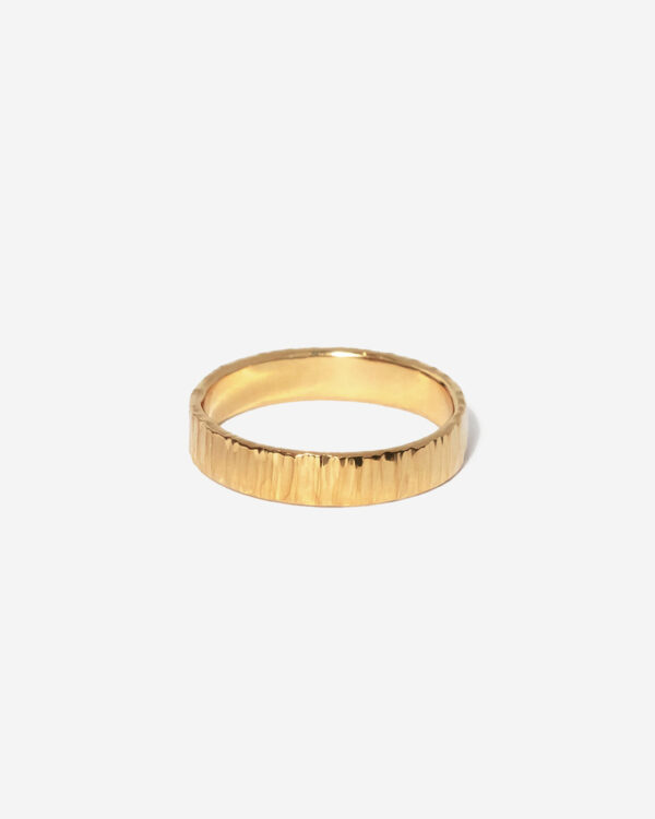 A 3mm wide gold ring band with a beautiful hammered surface texture. The ring is 100% handmade with Sterling Silver and Gold plating